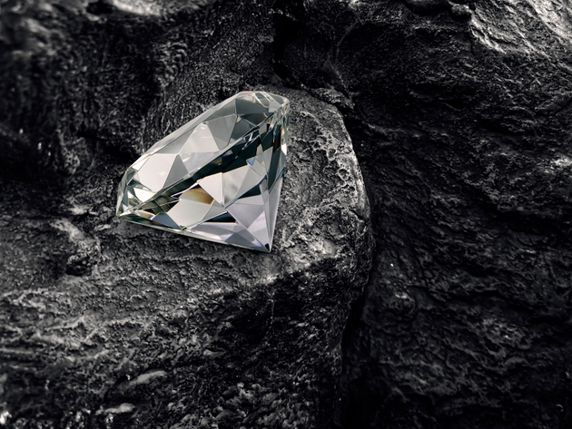 diamond on black coal background