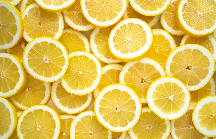 Lemon fruit slices arrangement in a row full frame background