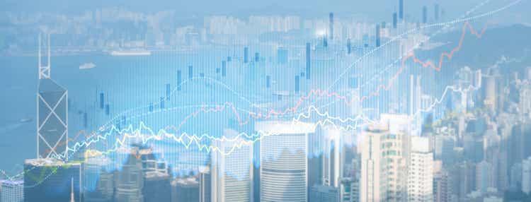 Smart city and stats concept with growing digital graphs and diagram on city background