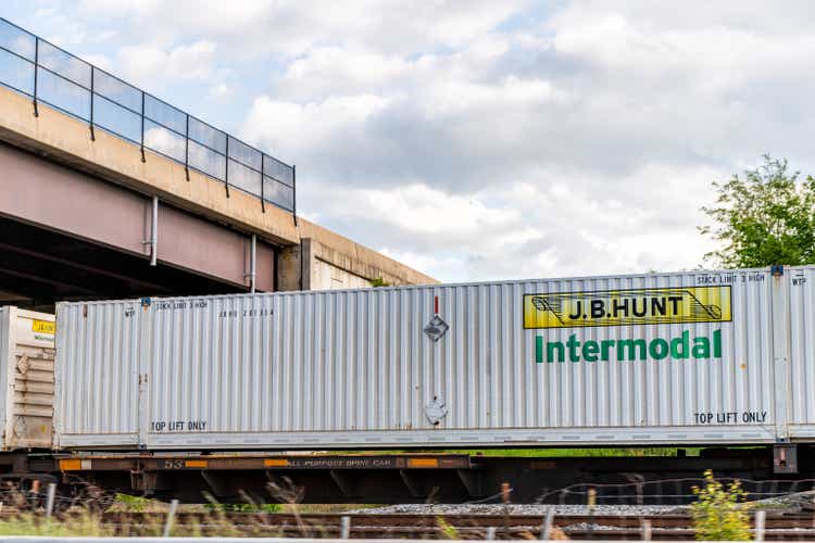 JB Hunt Intermodal cargo shipping container on train in Virginia railroad locomotive tracks shipment on route moving