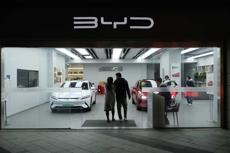 BYD EV car store and customers. Chinese electric car company