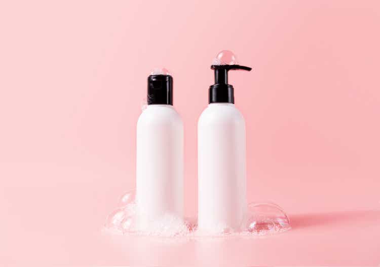 Shampoo and hair conditioner bottle with soapy bubbles. Beauty hair care cosmetic packaging mockup