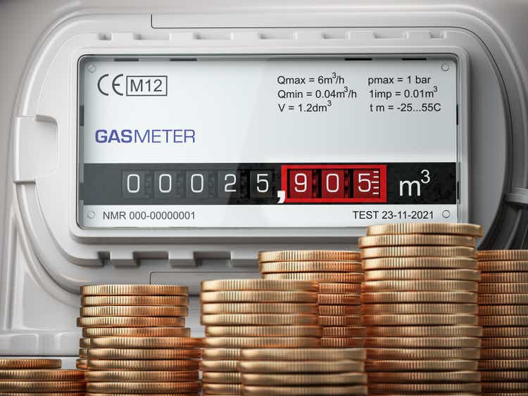 Growth of natural gas price. Savings of energy and energy efficiency concept. Gas meter with stacks of coins.