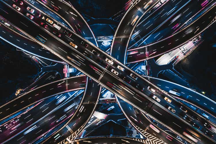 Drone point view of overpass and city traffic at night