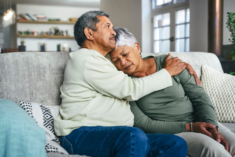 Shot of a senior man supporting his wife during a difficult time at home