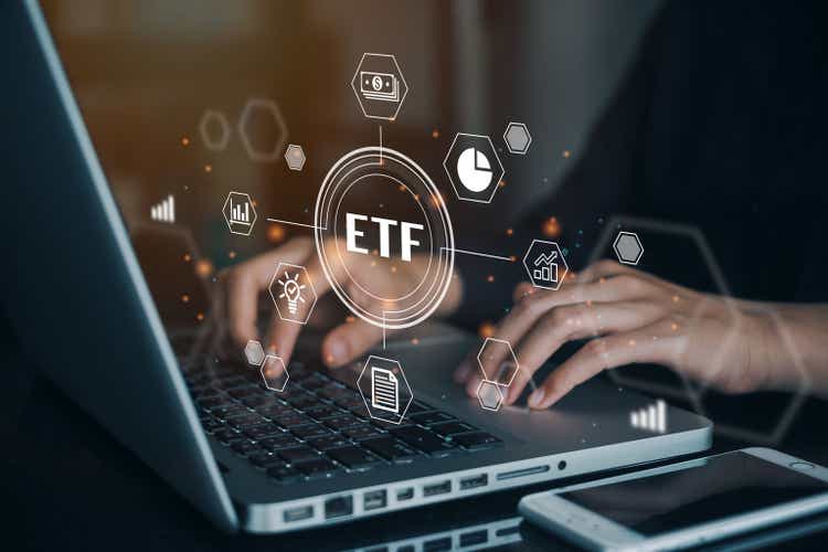 Stock market trading investment financial concept of man working on computer to ETF exchange.