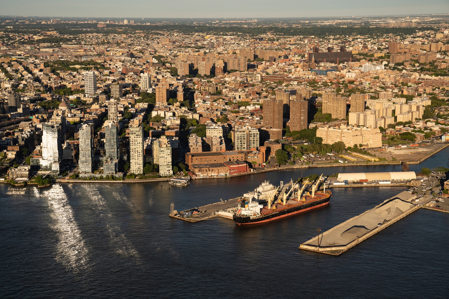 Aerial photo looking down at cargo ship docked in Brooklyn, NY