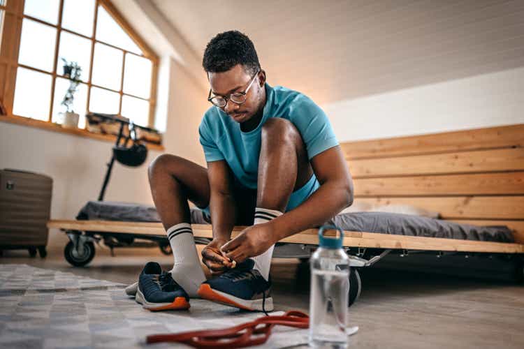 Man wearing shoes preparing for workout