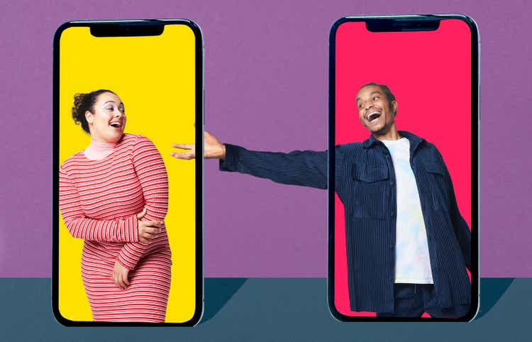 Young woman and man inside smartphone flirting