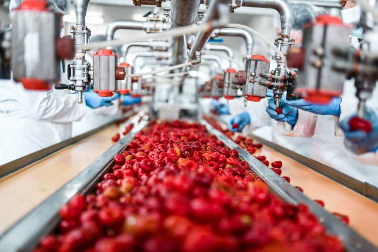 Workers pitting cherries in a chia pudding factory