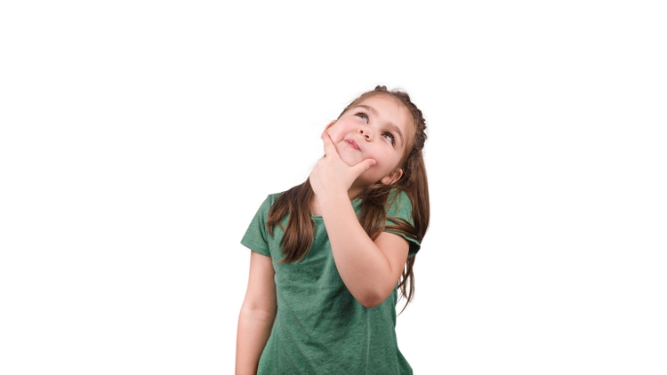 isolated beautiful girl in a green t-shirt is thoughtful and looks up on a white background