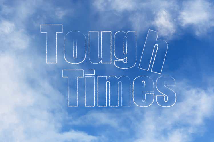 Word "Tough Times" from clouds in a blue sky