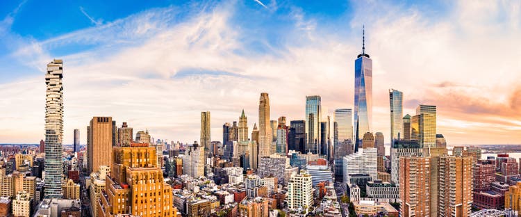 Aerial panorama of Lower Manhattan skyline at sunset