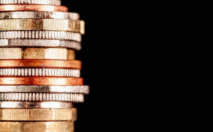 Stack of British coins on black background