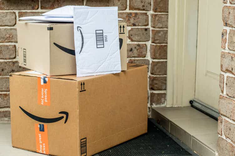 Amazon prime boxes and envelopes delivered to a front door of residential building