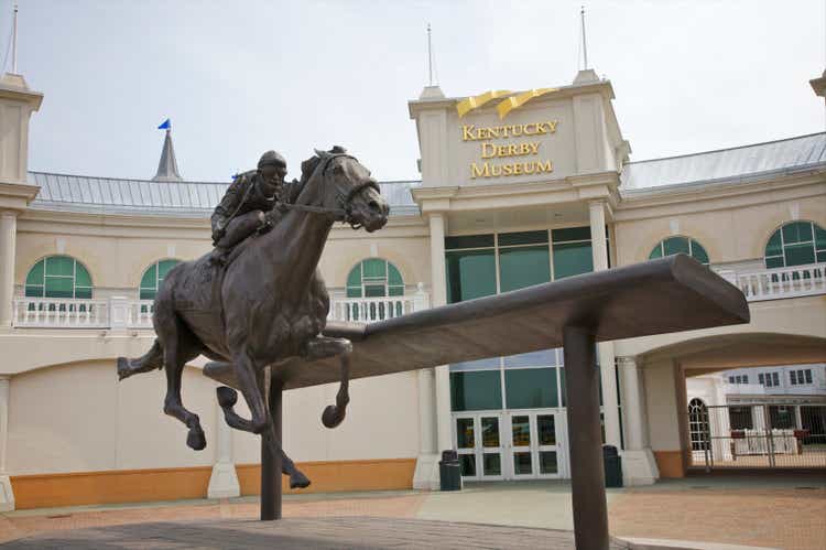 Sculpture of jockey and horse seen from below.