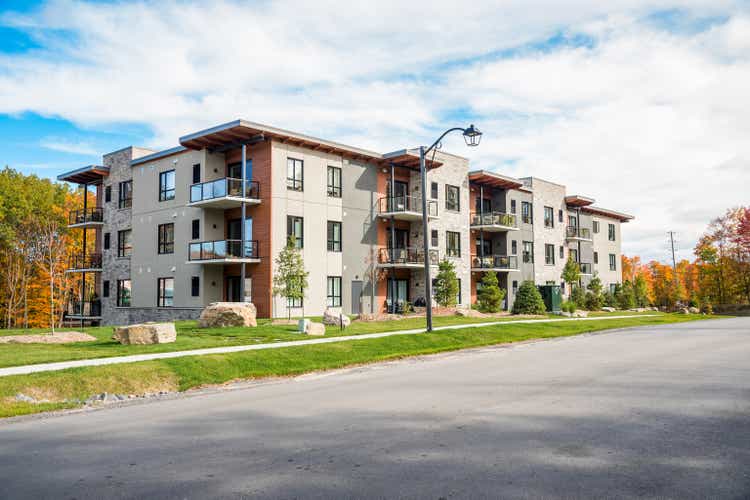 New aprtment building in a housing deveopment on a sunny autumn day