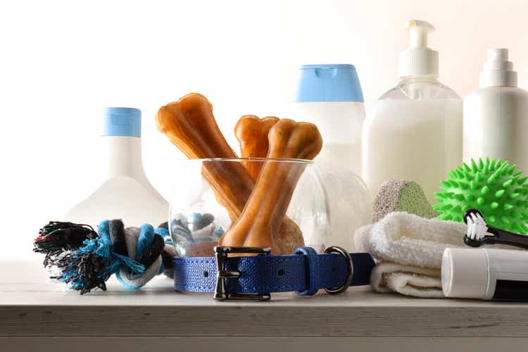 Dog bath products on wooden table isolated background