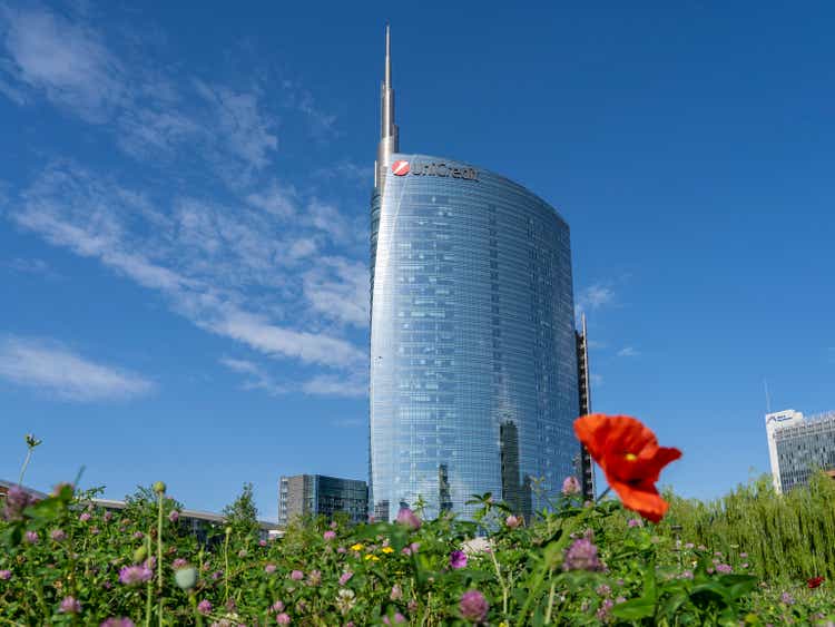 Milano, Italy. The iconic Unicredit tower and the BAM public park. Skyscraper which is part of a group of residential and business buildings. People at the park