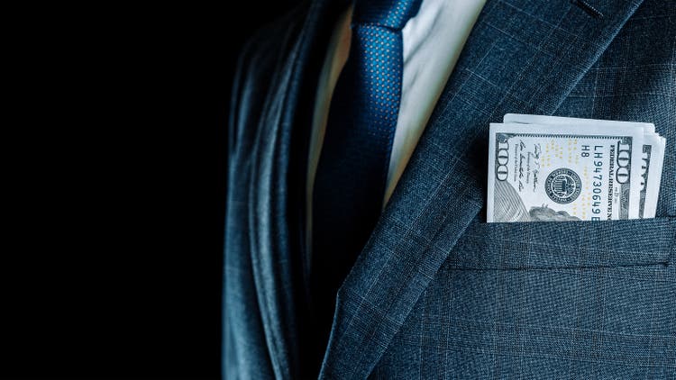 The dollar sign. Rich businessman holds American money. The background of the dollar cash bill.