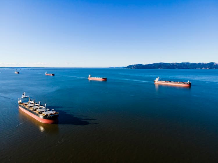 Packed harbor with ships waiting to load.