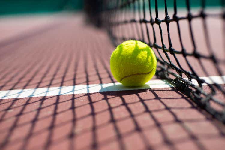 Tennis ball lying on the court. Healthy lifestyle concept