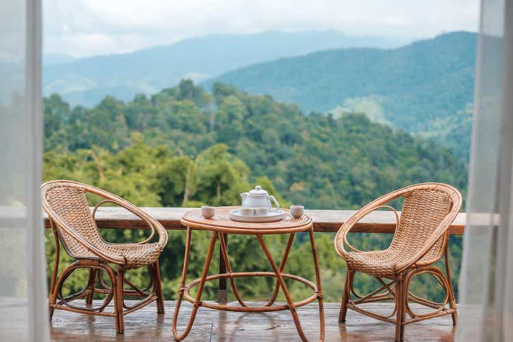 teapot set on table in the morning with mountain view at countryside home or homestay. Vacation, travel and trip concept