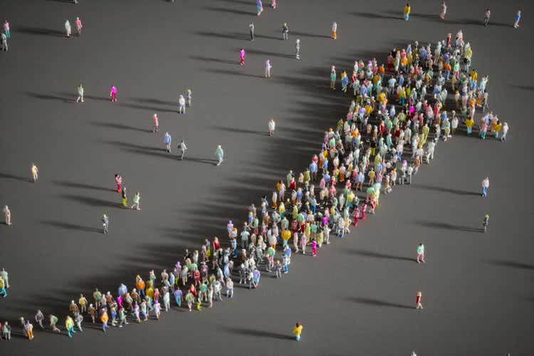 Large Group Of People Forming A Growing Arrow