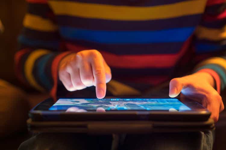 Close up of a young boy using a tablet computer