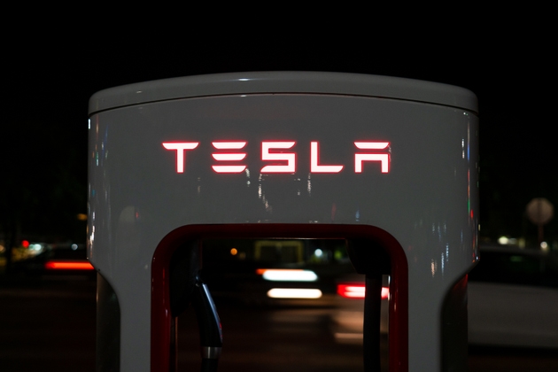 Tesla Supercharging station illuminated at night