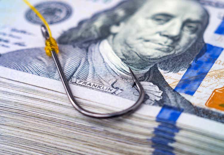 Meridian Contrarian Fund Q3 2022 Investment Commentary - Seeking Alpha 1 Fish hook on a stack of US 100 dollar bills.