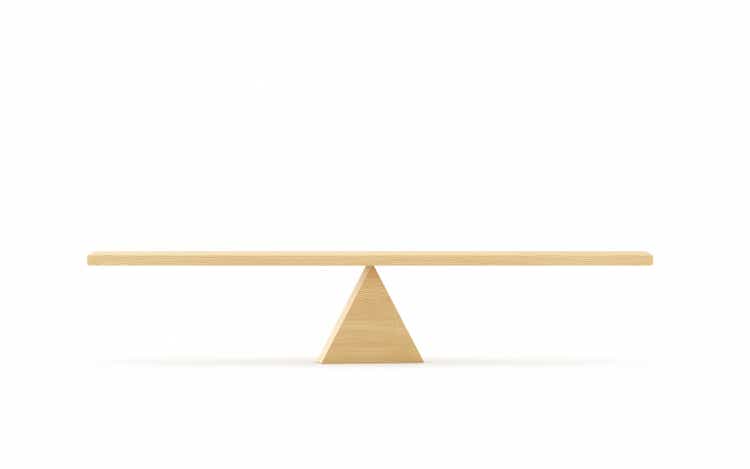 Wooden Seesaw Scale Sitting Balancing Front View on White Background stock photo