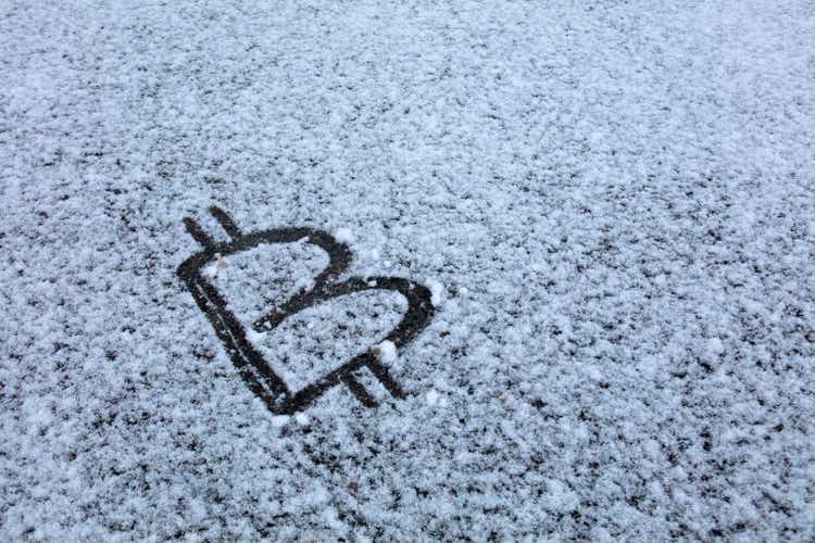 Bitcoin Sign on snow