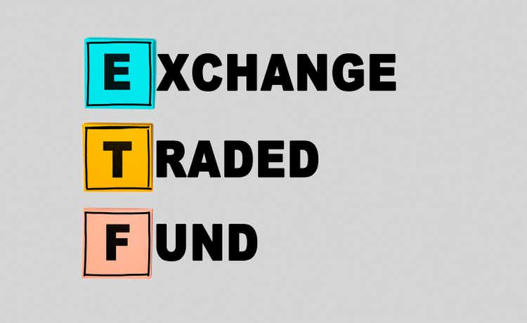 ETF - Exchange Traded Fund abbreviation on gray background, real time mutual index fund that can trade in equity stock market. Business concept