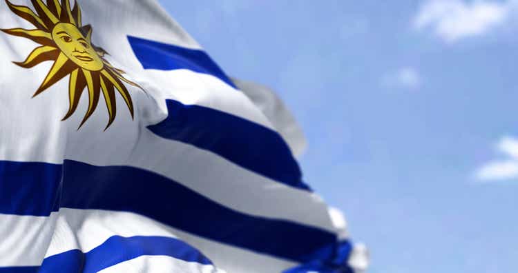 Detail of the national flag of Uruguay waving in the wind on a clear day