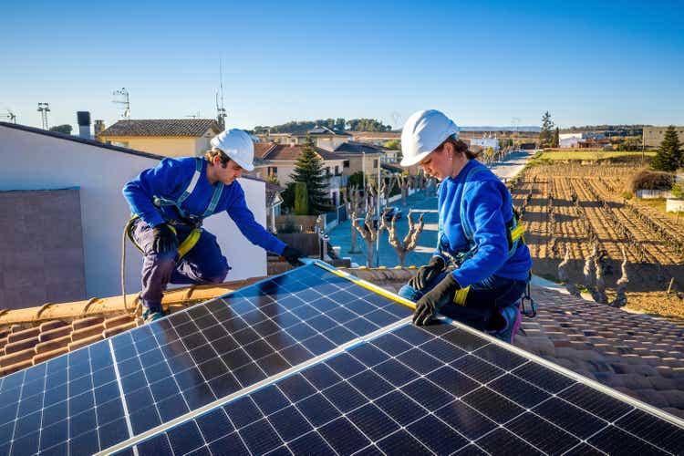 measuring solar panels installation on a roof