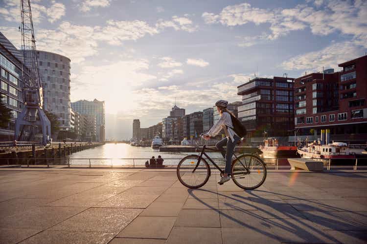 Young woman riding a bike