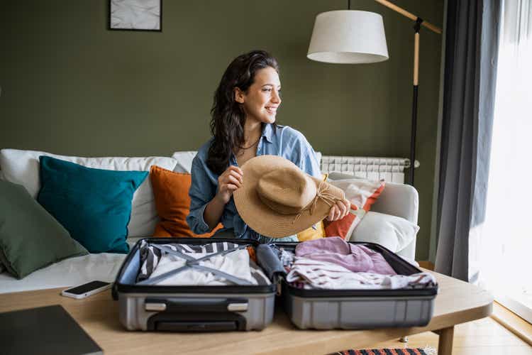 Portrait of a woman preparing for a trip