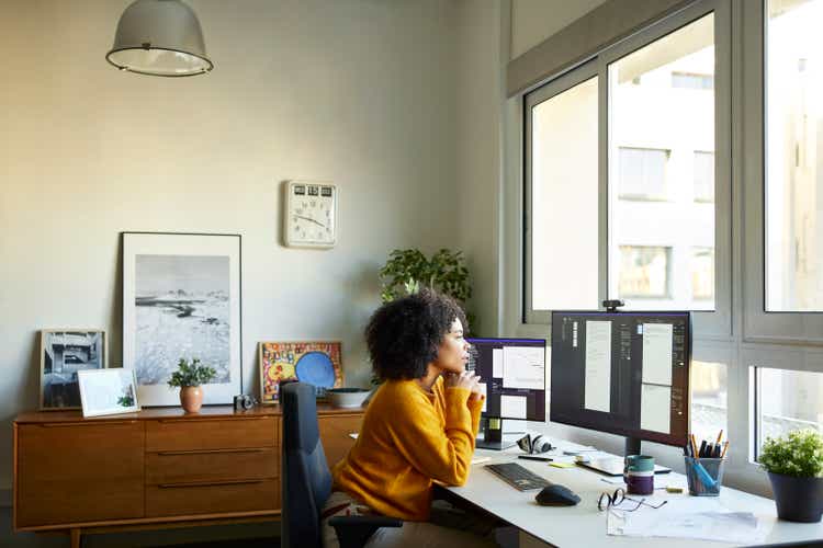 Businesswoman using computer at home office