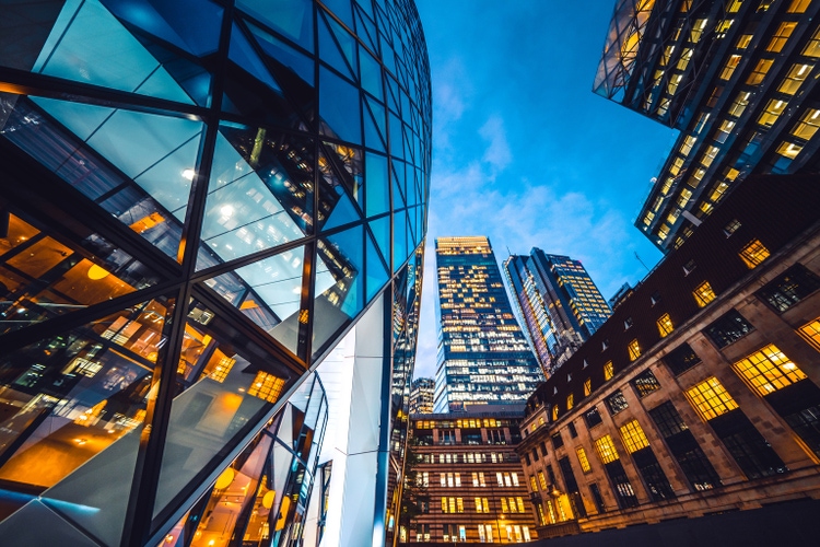 Looking directly up at the skyline of the financial district in central London