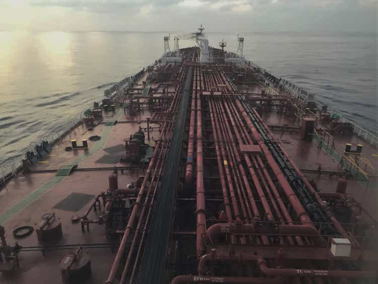 A tanker is underway at sea in the evening, view from the wings of the bridge