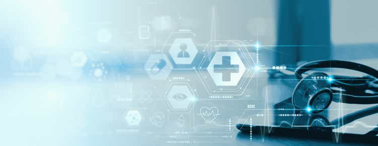 Close up of a stethoscope and digital tablet with virtual electronic medical record of patient on interface.Digital healthcare and network on modern virtual screen, DNA medical technology and futuristic concept.