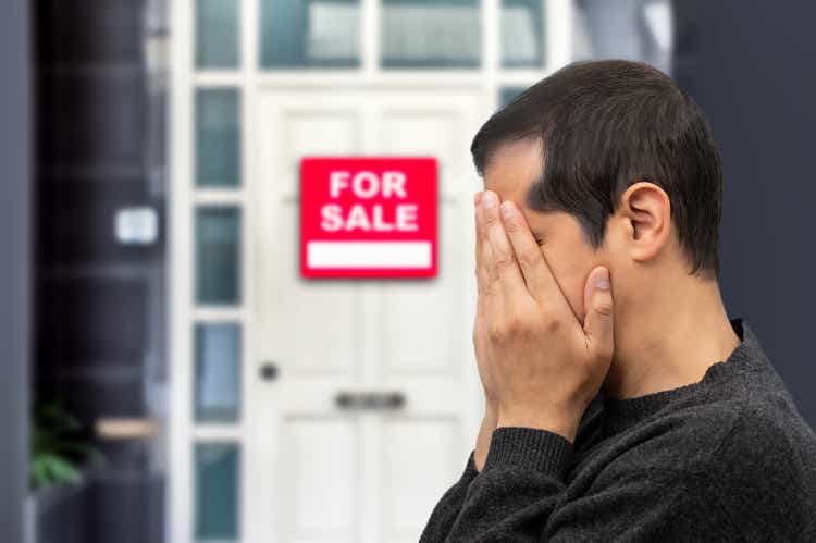 depressed man losing his house due to debts and mortgage