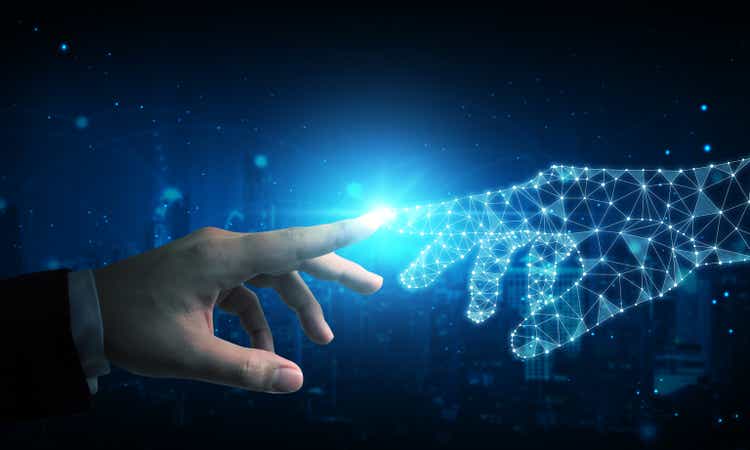 Hand of businessman touching hand artificial intelligence meaning technology connection go to future