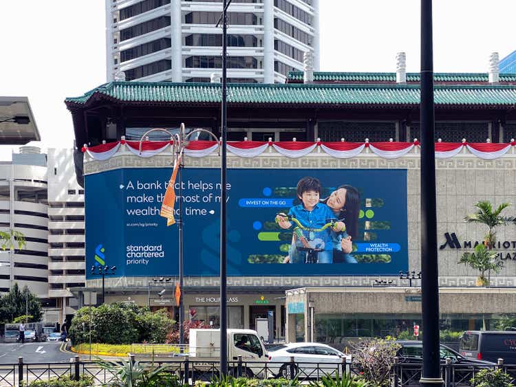 Singapore 2021 View of Singapore Marriott Tang Plaza Hotel with large advertising out of home billboard by Standard Chartered Bank. The bank underwent a major brand identity refresh in 2021.