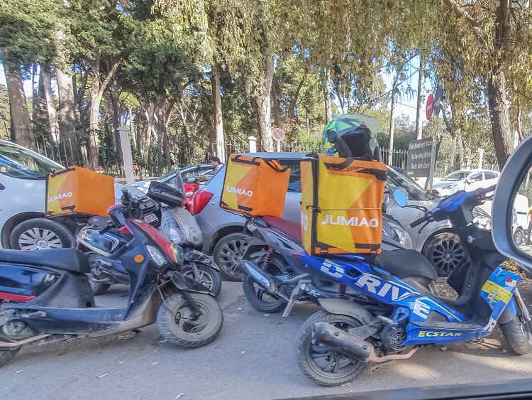 Scooter Motorcycles of the delivery service firm Jumia logistics services parked.