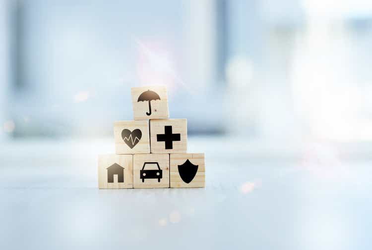 Shot of wooden blocks with insurance related symbols on them