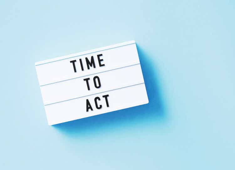 Time To Act Written White Lightbox Sitting On Blue Background