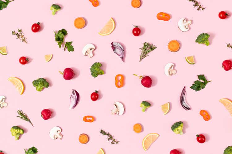 Pattern of healthy organic food with vegetables on summer pink background