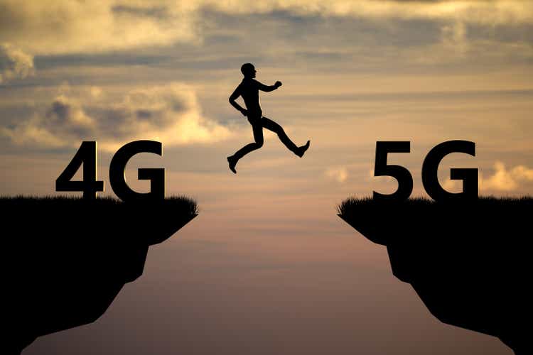 Silhouette man jumping on a cliff from 4G to 5G with sunset sky background